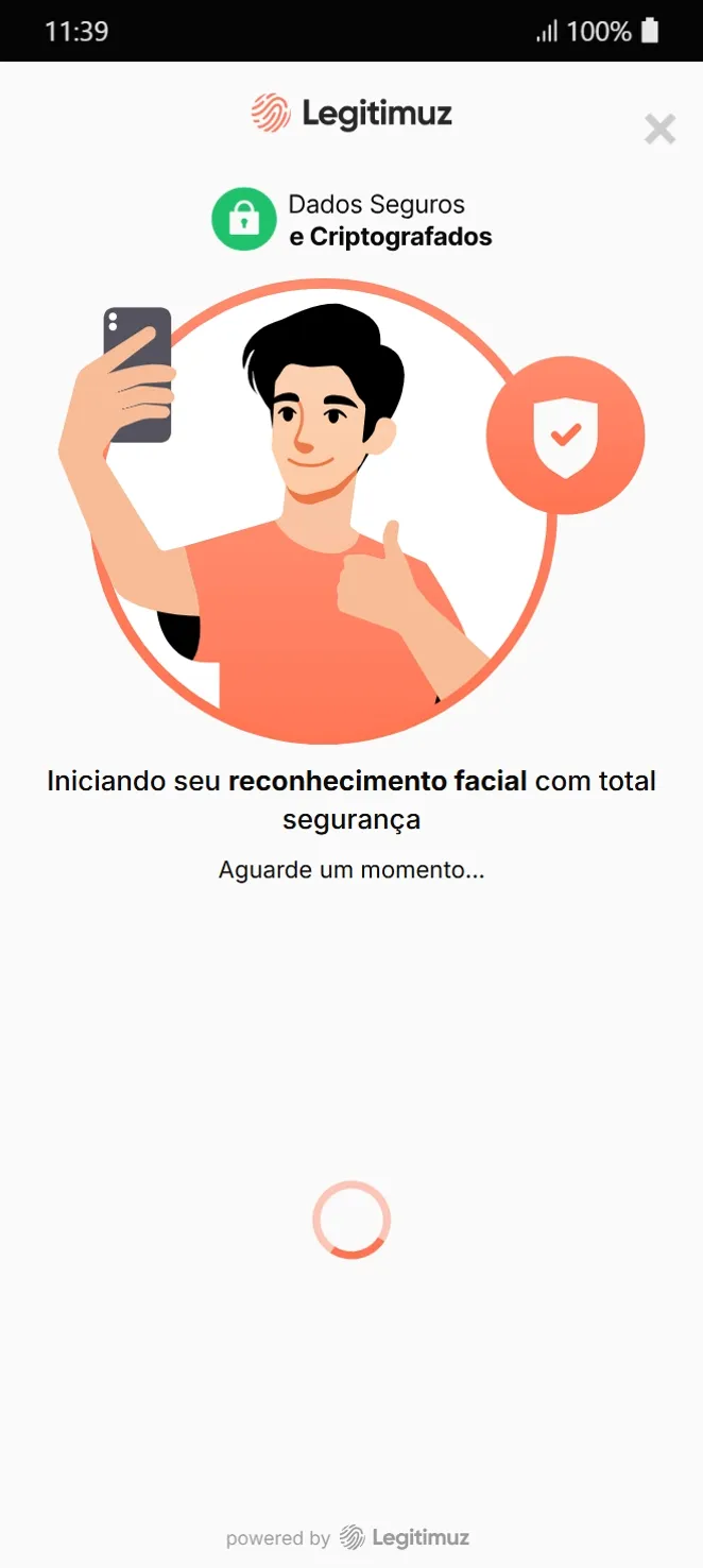 Tela da Legitimuz com ilustração de reconhecimento facial, texto "Iniciando seu reconhecimento facial com total segurança" e mensagem "Aguarde um momento" com progresso em carregamento.
